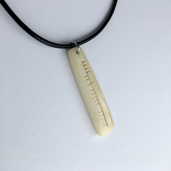 Ogham carved pendant