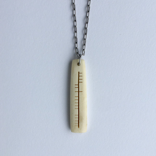 Ogham carved pendant