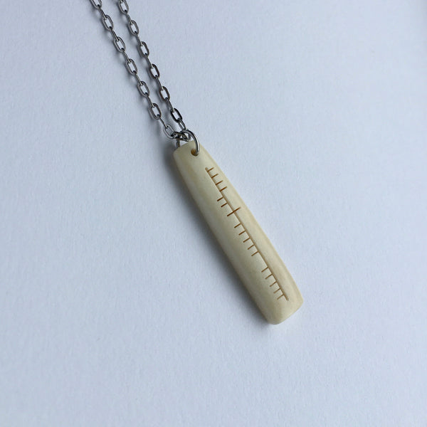 Ogham carved pendant