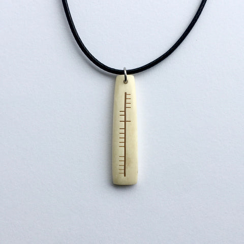 Ogham carved pendant